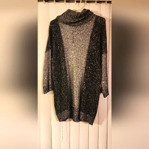 A women's black and silver sweater, long sleeve